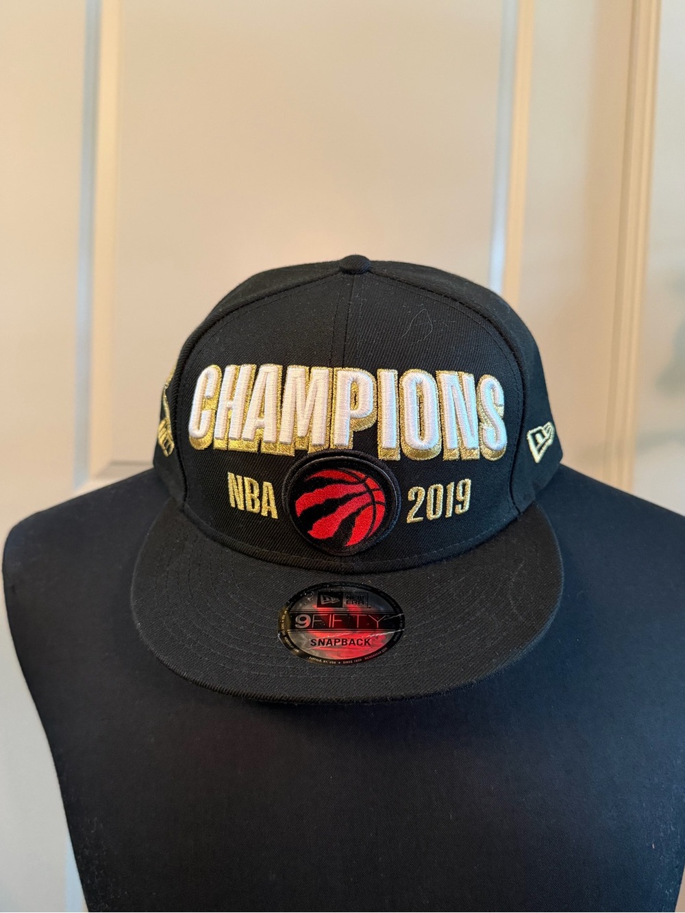 New Era Black and Gold RAPTORS NBA 2019 Champions Snapback with Red Logo